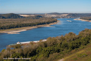 Mississippi River with barges during the dry season. | Credit: Matthew Mansell, Shutterstock