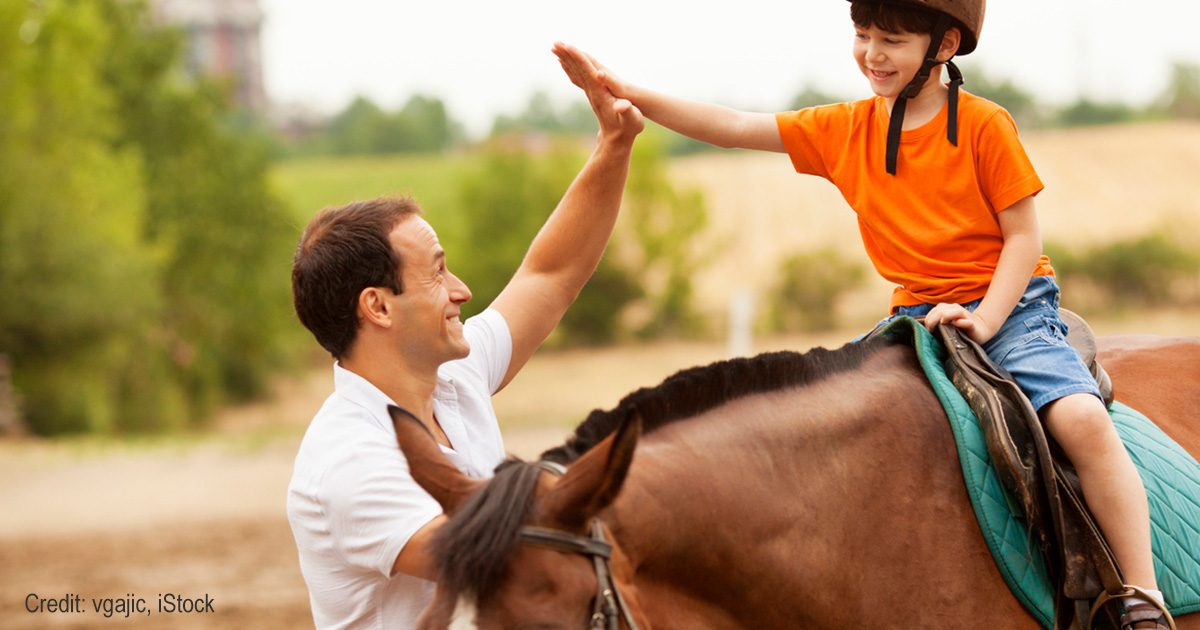 Child on horse | Credit: vgajic, iStock