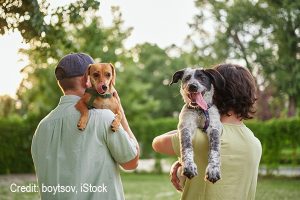Love, portrait and family with dog at animal shelter for adoption at kennel Credit: boytsov, iStock